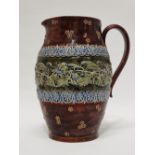 Doulton Lambeth England - A tall handled jug with bas relief, 6808 and maker's mark RB to base,
