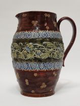 Doulton Lambeth England - A tall handled jug with bas relief, 6808 and maker's mark RB to base,