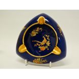 Carlton Ware - A triform Blue Royale style ashtray with pheasant decoration, width 13cm.