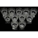 Crystal glasses - A set of ten (plus a spare) hobnail decorated cut pedestal glasses with square and