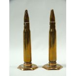 MILITARIA - Trench Art, a pair of cruets formed as empty 42 bullet shells, height 14cm.