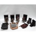 Four folding roll-film cameras various manufacturers, each with lens in Bausch & Lomb pneumatic
