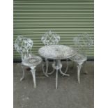 A white painted Victorian style aluminium garden table and three white painted grape and vine