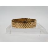 9ct gold bracelet - Flat weave bracelet with safety chain, weight 42.1g.