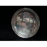 Tiffany & Co. a sterling silver tray with pierced and fretted edge engraved to the centre '1889-
