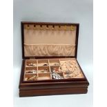 A jewellery box containing costume jewellery and a black, possibly jet necklace and earring set.