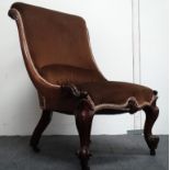 Victorian slipper chair - A mahogany framed overstuffed chair with carved detail to front short legs