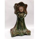 Art Nouveau ceramic cased clock - Green glazed and marked G 1914 within, having a figure in a