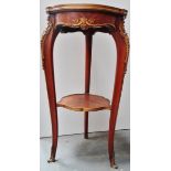 A Louis XVI style etage - A French kingwood and ormolu tripod two tier etage with rouge marble