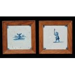Delft - Two framed tiles, one depicting a windmill at the sea's edge, the other depicting a juggler,