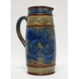 Royal Doulton - A glazed handled jug, 5??7 and maker's mark MB to base, height 17cm, diameter 6.5cm.