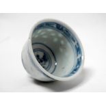 A Chinese bowl - A blue and white decorated bowl with floral and bird decoration to the centre,