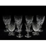 Crystal and cut glass - A set of four crystal dimple and cut decorated pedestal wine glasses, height