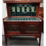 Arts and Crafts - An oak tile back washstand with embossed copper panels to the two cupboard