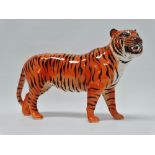 Beswick - A tiger, height 19cm, length 30cm.