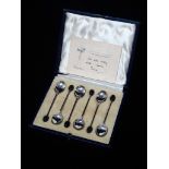 A set of six silver plated bean top teaspoons, Sheffield 1928, maker's mark for Mappin & Webb, in