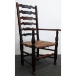 A set of twelve Yorkshire ash ladder back chairs - Two carvers and ten singles with rush and