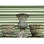 Urn and planters - A reconstituted stone urn, height 46cm, width 31cm and two planters, height 24cm,