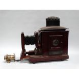A mahogany and brass horizontal enlarger sold by the Army & Navy Photographic Department, London,