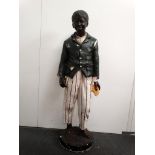 Shop Display Figure - A polychrome plaster life size figure of an African American boy with a