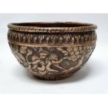 Indian late 19th/early 20th century brass bowl - Repousse decorated with two images of the winged