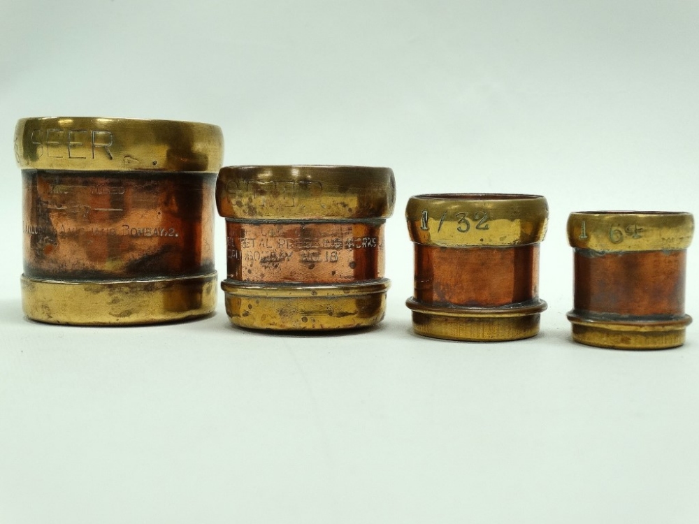 Indian graduated measures - A set of four copper and brass measures bearing Customs and Excise