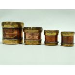 Indian graduated measures - A set of four copper and brass measures bearing Customs and Excise