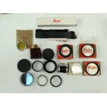 An as new Leica Carrying Strap in maker's box; three Leitz Wetzlar Elpro supplementary lenses nos: