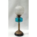19th century oil lamp - A tall pedestal acid cut globe over a teal glass reservoir with twist