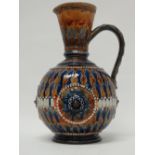 A Doulton Lambeth 1880 - A pot bellied jug glazed and decorated in bas relief, stamped HW and