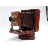 A half-plate brass-bound mahogany 1894 Instantograph field camera by J. Lancaster & Sons, Birmingham
