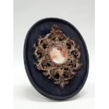 MINIATURE - A hand painted oval of a young Victorian lady having an impressive filigree silver