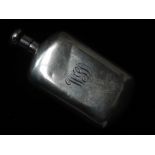 A small silver hip flask with screw cap, engraved monogram, indistinct marks, height 8cm, weight