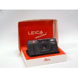 A Leica (Japan) Mini 35mm compact camera with Elmar 35mm f 3.5 lens, in maker's box.
