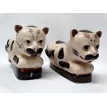 Chinese animal headrests/pillows - A pair of pottery glazed pillows in the form of recumbent black
