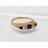 An 18ct gold diamond and sapphire ring - An 18ct gold ring set three sapphires and two diamonds,