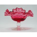 Cranberry Glass - A pedestal frilled edge bowl with clear glass stem and base, height 11.5cm,
