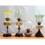 19th century oil lamps - A collection of six assorted glass reservoired oil lamps, some with brass