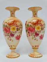 Carlton Ware, W & R Stoke on Trent - A pair of blush baluster, footed and gilt rimmed vases with