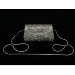 A silver dress handbag, with pierced and chased decoration and stamped .925, with shoulder chain,