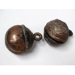 Indian 19th century brass crotal bells - One with Sanskrit inscription, both approximately