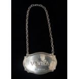 A silver bottle tag/decanter label 'Vodka', Birmingham 1989, maker's mark for C. Robathan & Son,