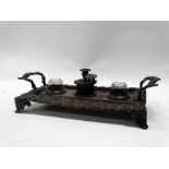 Regency standish - A early 19th century two handled cast brass inkstand having two glass inkwells