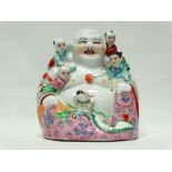 Chinese 20th century ceramic Buddha - A smiling Buddha sat with five children, impressed character