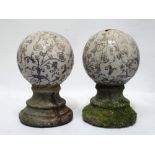 Finials - A pair of circa 1900 hand painted ceramic spheres on turned stone socles and bases, height