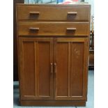 Cotswolds School lowboy - An oak mid century unit, two long drawers over two cupboard doors,