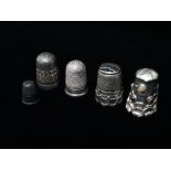 Five silver thimbles, one with agate end, indistinct marks, possibly Charles Horner, another set