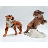 Beswick animals - Cougar on rocks No.1823, height 14cm, together with a tiger, length 21.5cm.