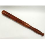 Circa 1910 truncheon - A turned walnut and reeded handle police truncheon, length 43cm.