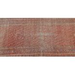 A Persian hand knotted woollen runner, 489 x 89cm.